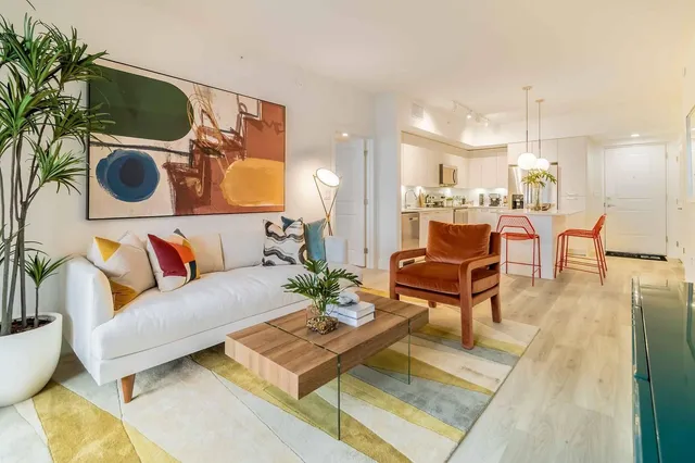 a living room with furniture and a rug