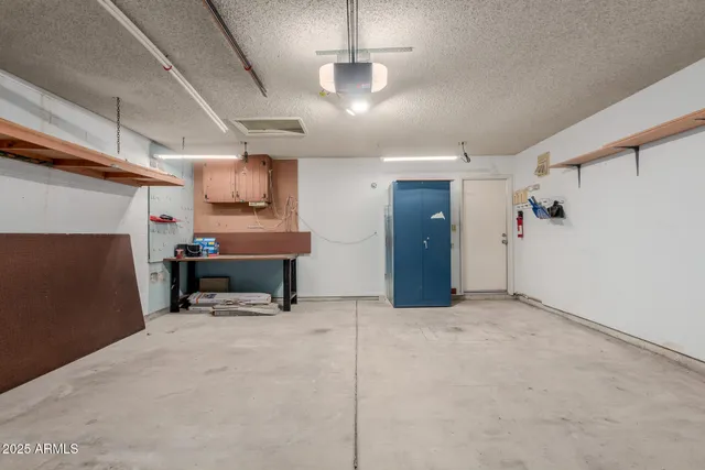 a view of an empty room with a fireplace