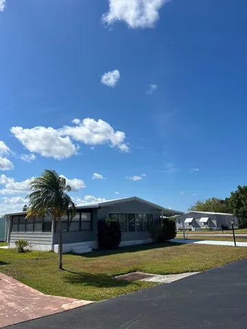 a view of a house with a big yard