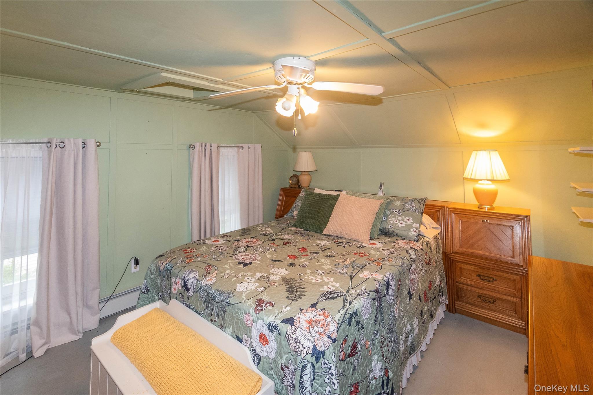 62 Thornton Road Wurtsboro, NY 12790 - Photo 20 of 30 a bedroom with a bed and a chandelier