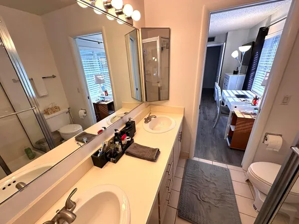 a bedroom with a bed and a mirror