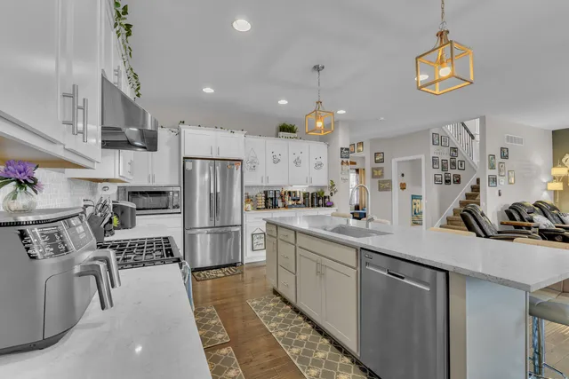 a kitchen with a sink and a potted plant