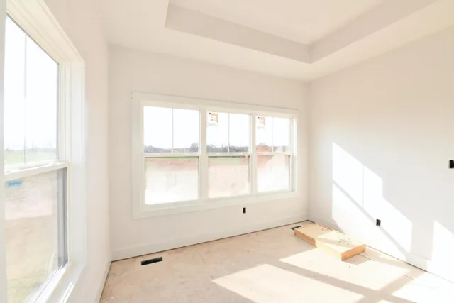 a view of a room with a sink and a refrigerator