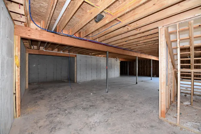 a view of a room with wooden walls