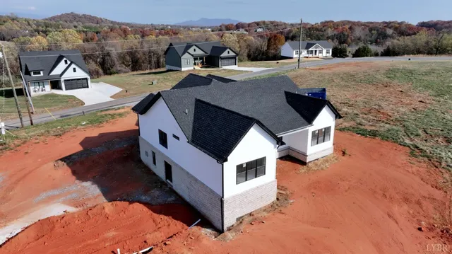 a aerial view of a house with a yard