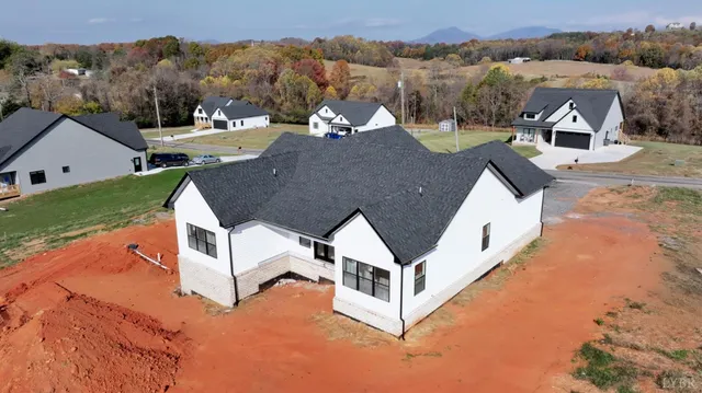 a view of a house with pool and mountain view