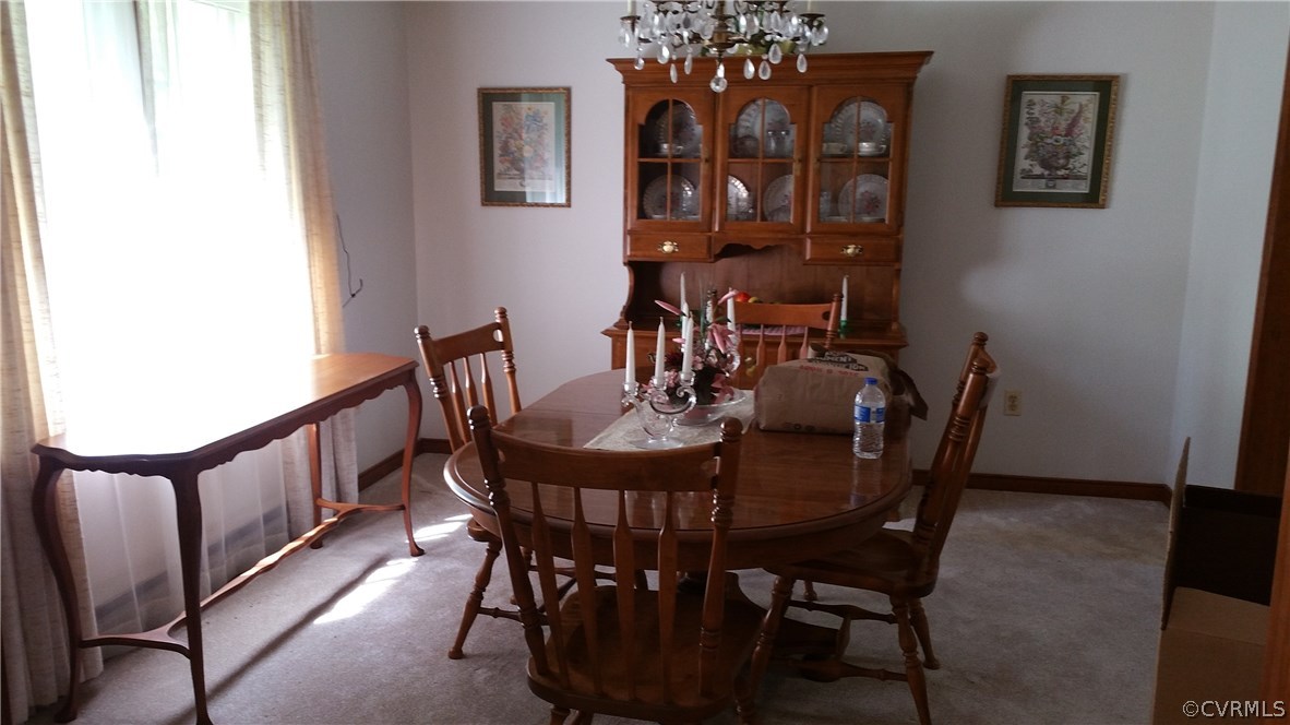 12620 Spring Run Road Chesterfield, VA 23832 - Photo 18 of 26 a view of a dining room with furniture and chandelier