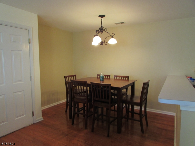 8 Genoble Road Montville, NJ 07045 - Photo 3 of 12 a view of a dining room with a table and chairs