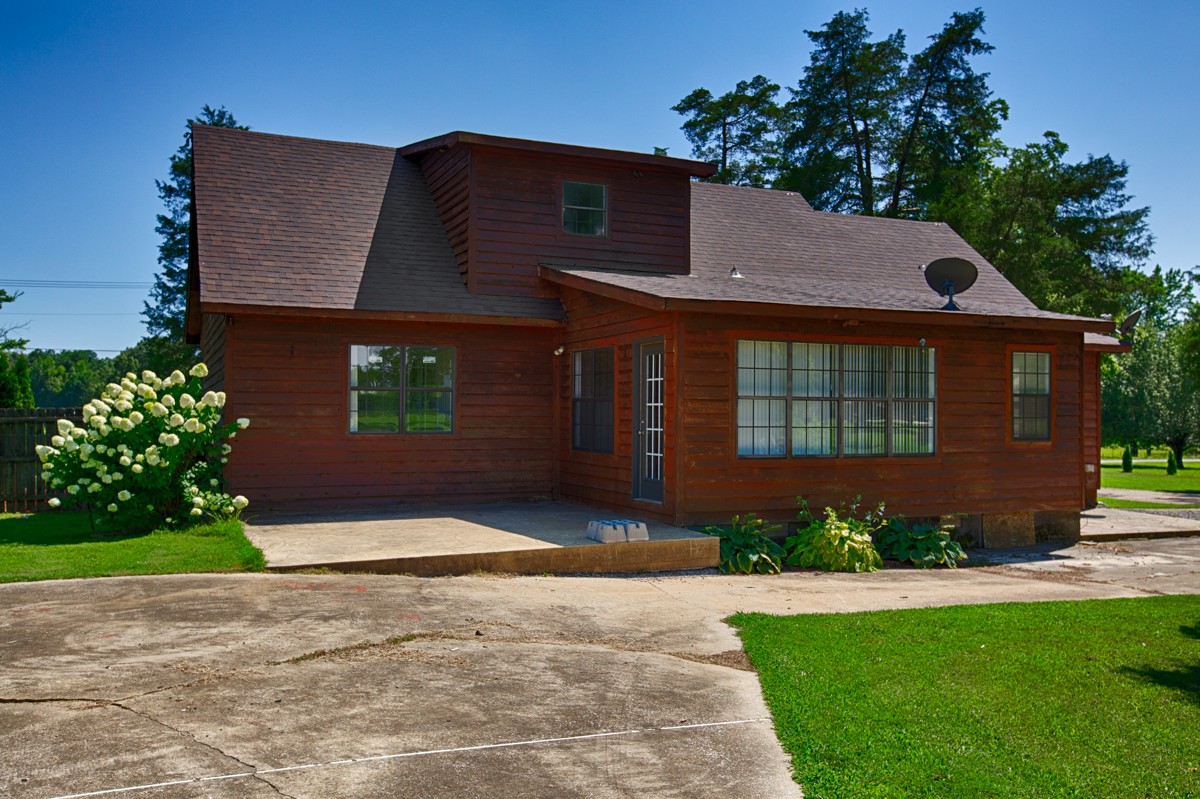 26939 Bethel Road Elkmont, AL 35620 - Photo 23 of 25 a front view of a house with a yard and garage