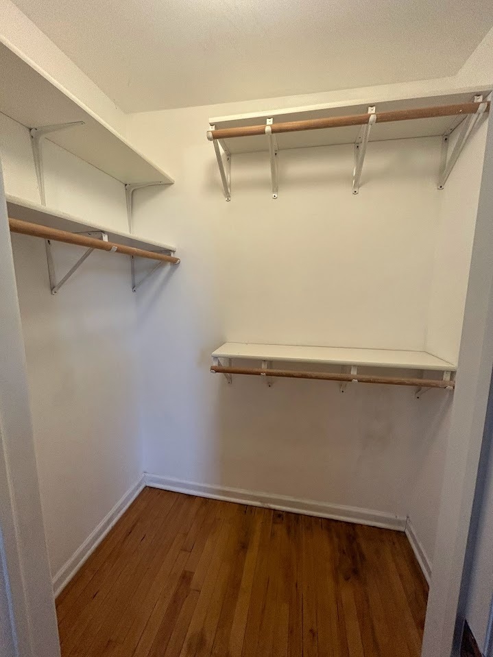 2052 East 68th Street, Unit 3 Chicago, IL 60649 - Photo 4 of 14 a view of a room with racks on the wall