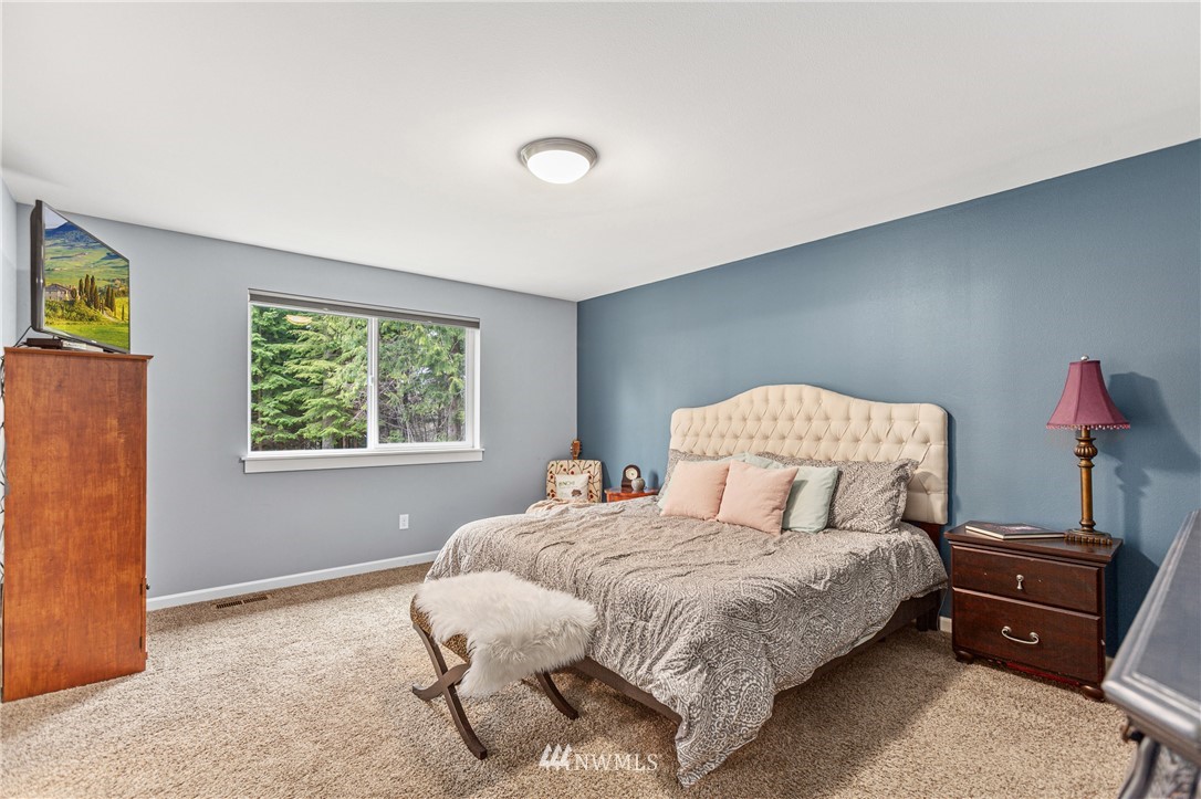 19614 Lerch Road Snohomish, WA 98290 - Photo 12 of 40 a bedroom with a bed and a window