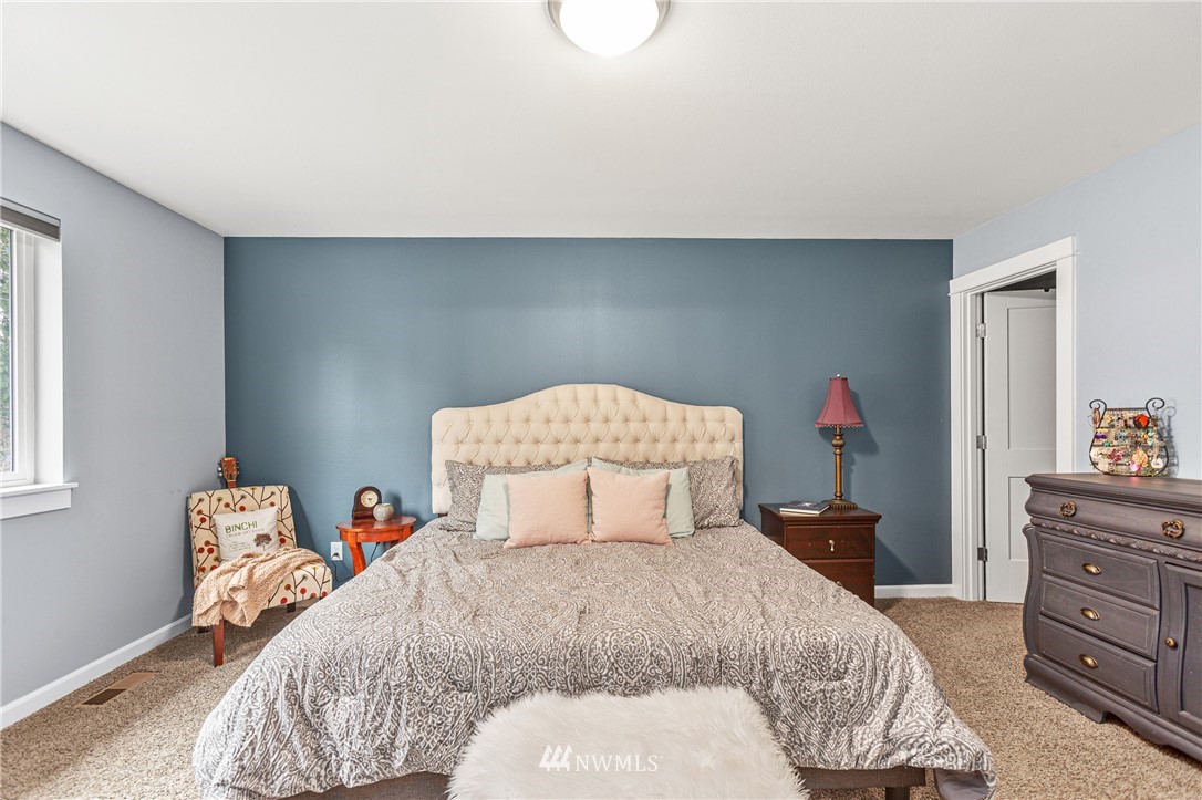 19614 Lerch Road Snohomish, WA 98290 - Photo 13 of 40 a bedroom with a bed and a closet