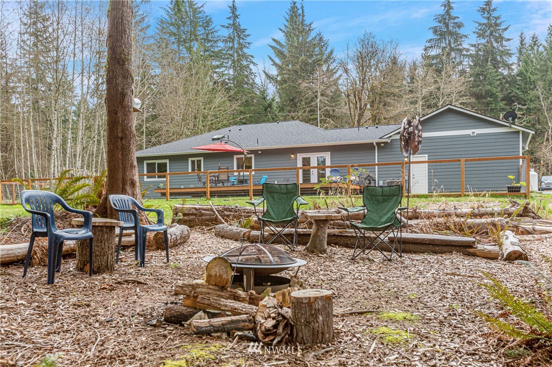 19614 Lerch Road Snohomish, WA 98290 - Photo 32 of 40 a group of table and chairs in front of house