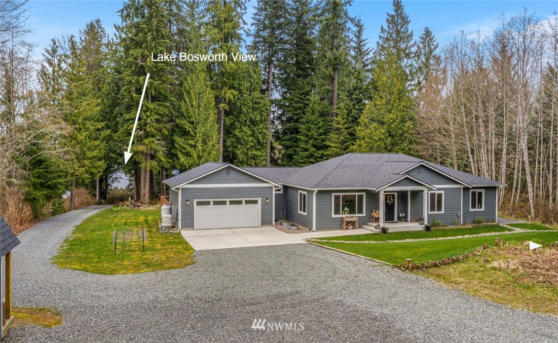 19614 Lerch Road Snohomish, WA 98290 - Photo 37 of 40 a front view of a house with a garden and trees