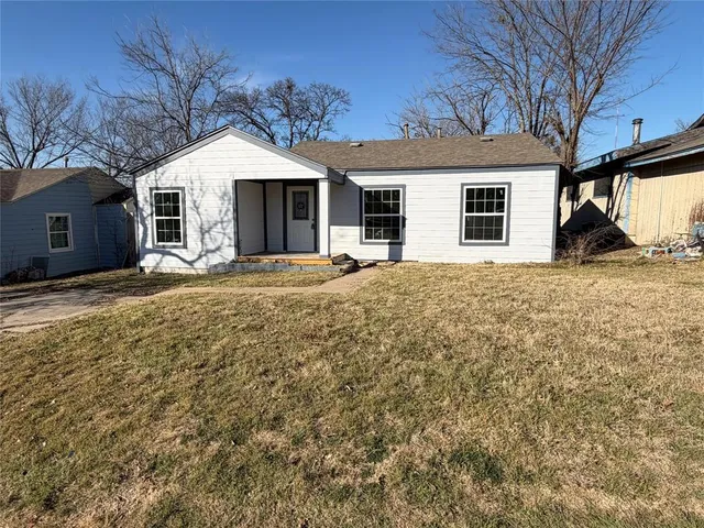 a house with trees in front of it