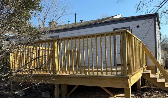 a front view of a house with a wooden fence