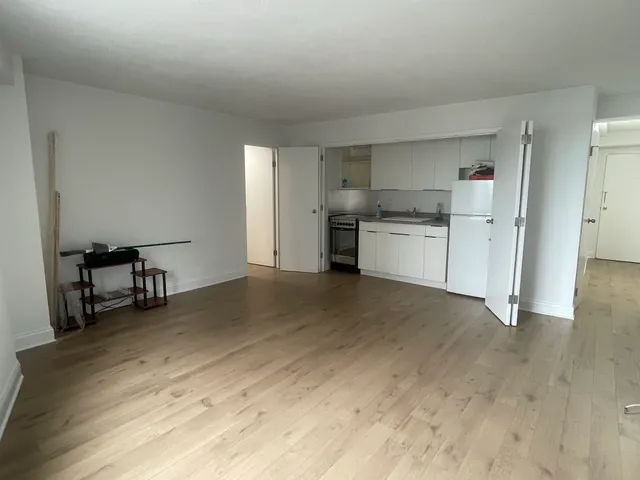 a room with furniture and wooden floor