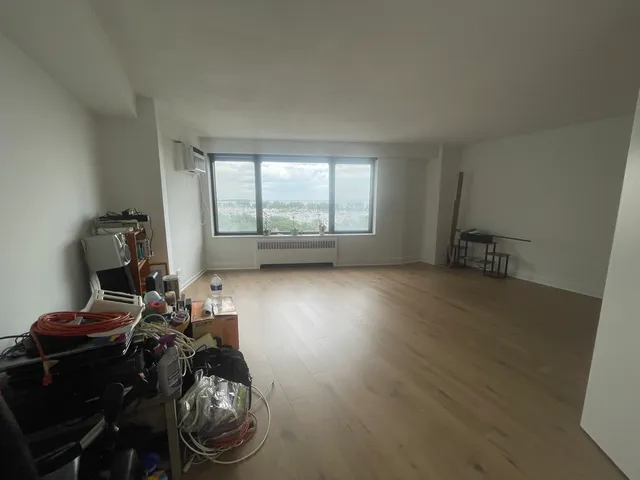 a view of hallway with wooden floor
