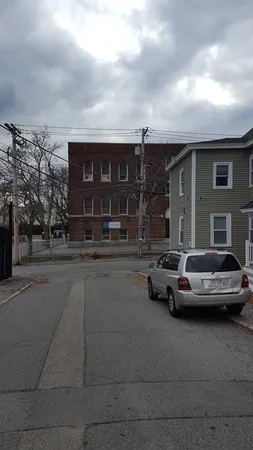 a view of a car parked in front of a house