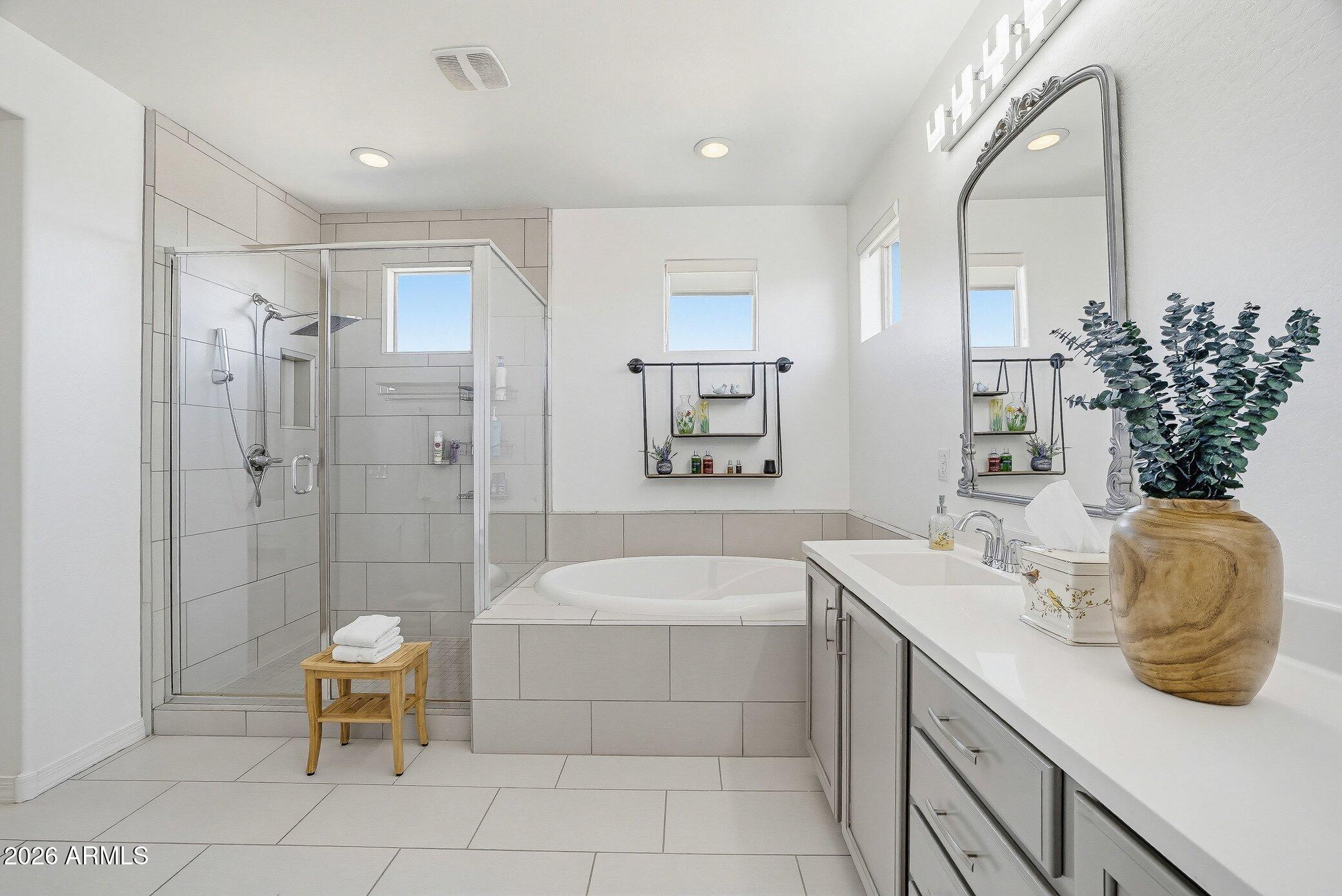 5819 South Wilson Way Gilbert, AZ 85298 - Photo 17 of 76 a bathroom with a sink a toilet and shower