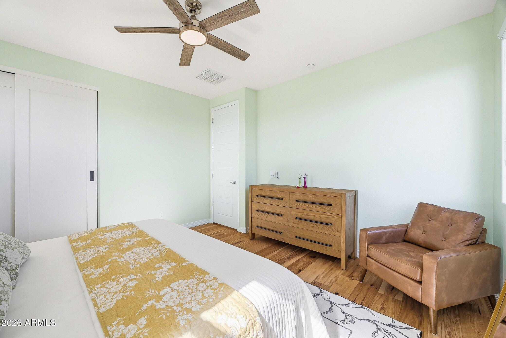 5819 South Wilson Way Gilbert, AZ 85298 - Photo 22 of 76 a bedroom with a bed and a couch