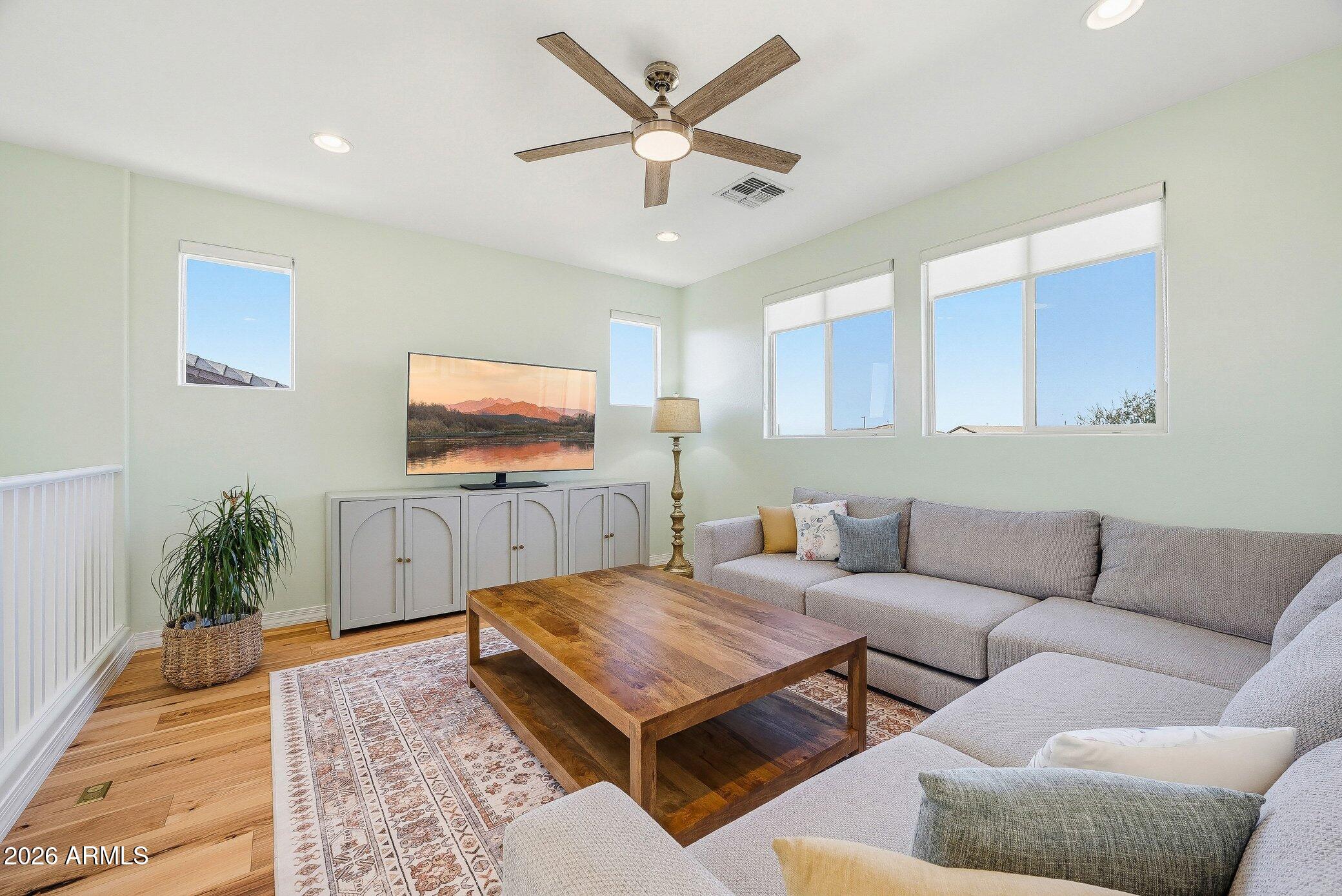 5819 South Wilson Way Gilbert, AZ 85298 - Photo 24 of 76 a living room with furniture and a flat screen tv