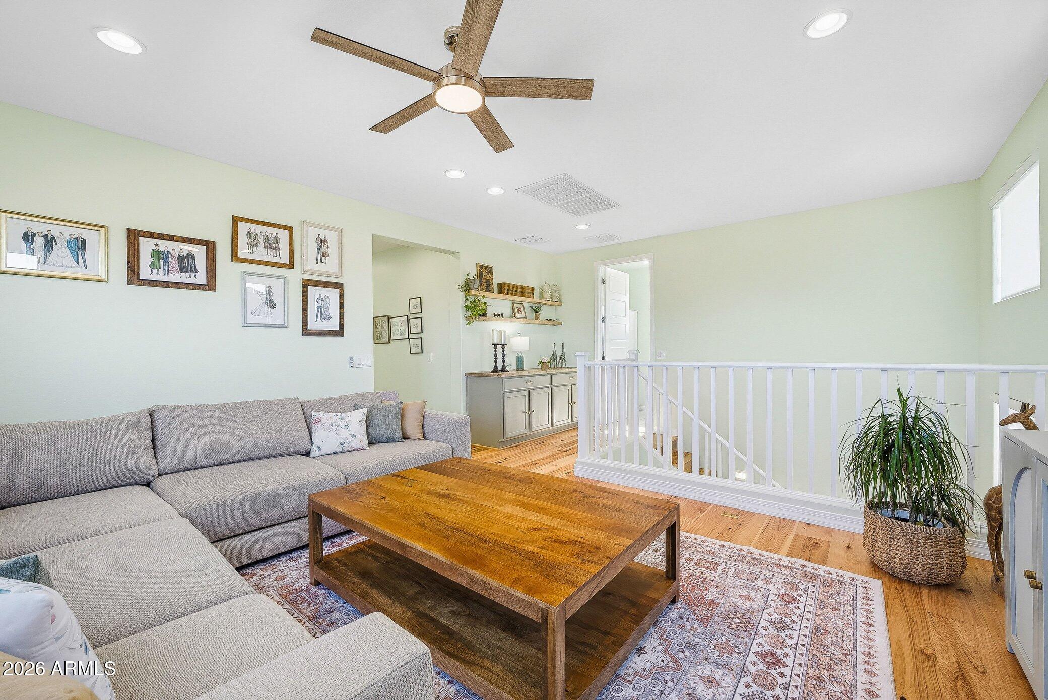 5819 South Wilson Way Gilbert, AZ 85298 - Photo 25 of 76 a living room with furniture and a potted plant