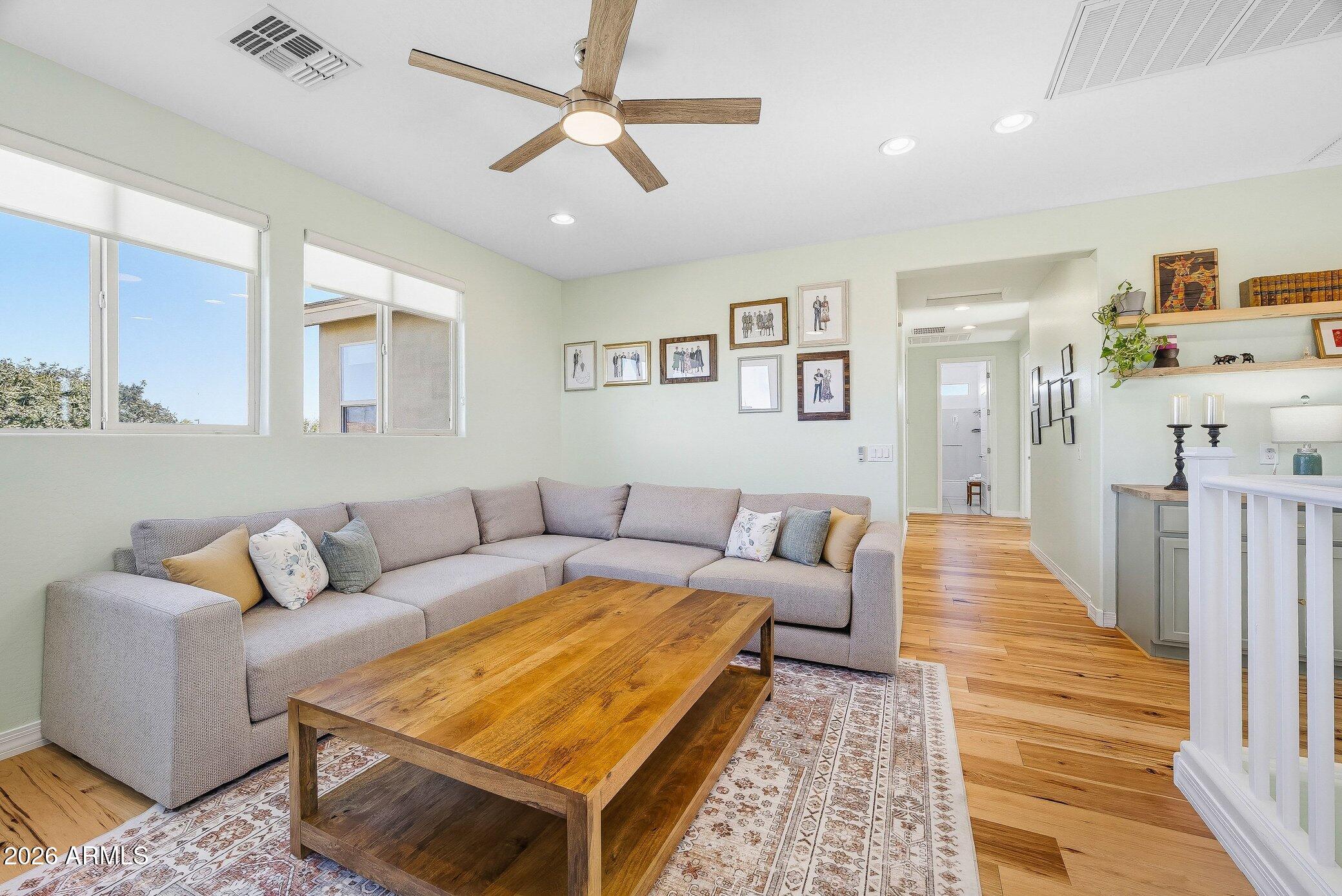 5819 South Wilson Way Gilbert, AZ 85298 - Photo 26 of 76 a living room with furniture and a rug