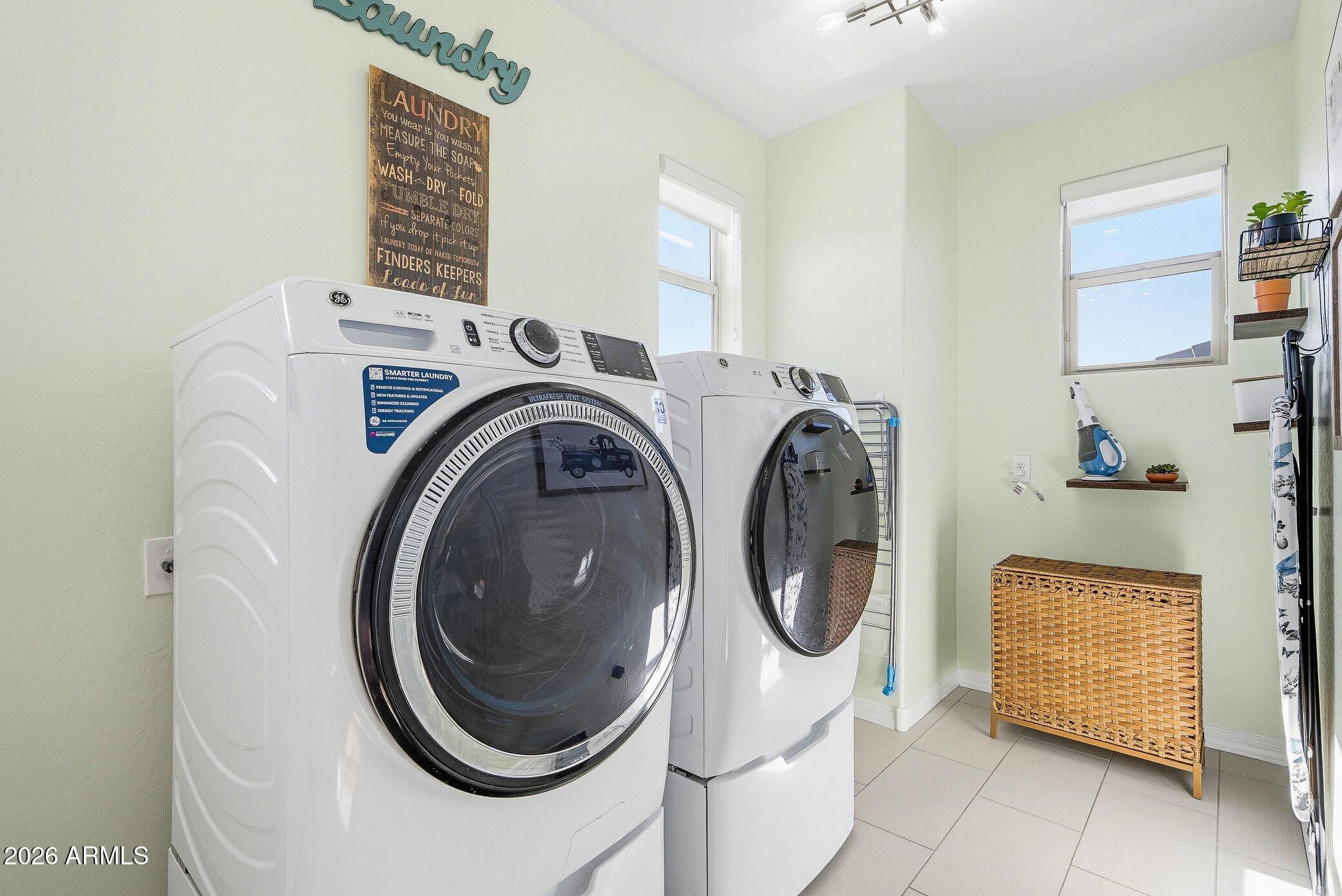5819 South Wilson Way Gilbert, AZ 85298 - Photo 28 of 76 a utility room with dryer and washer