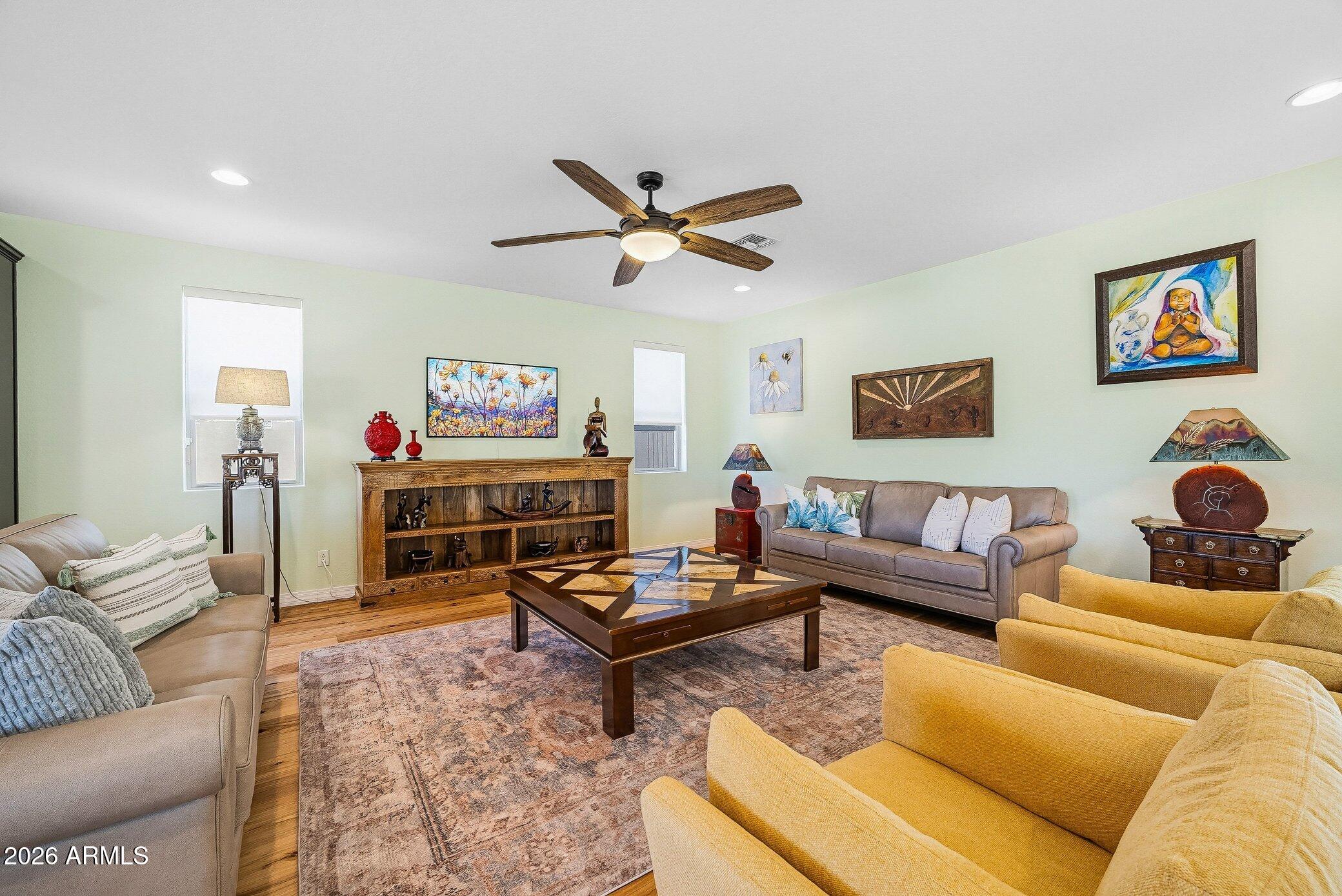 5819 South Wilson Way Gilbert, AZ 85298 - Photo 39 of 76 a living room with furniture and a flat screen tv