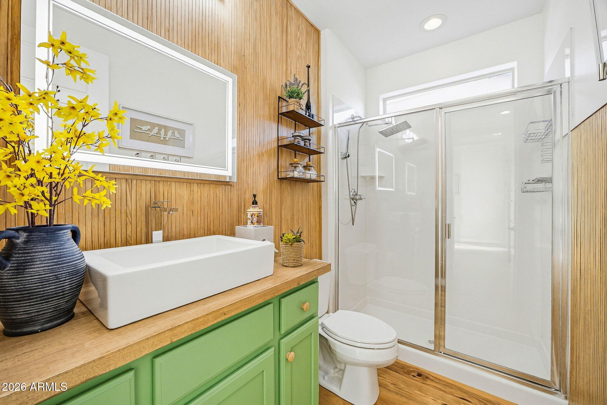 5819 South Wilson Way Gilbert, AZ 85298 - Photo 44 of 76 a bathroom with a sink a toilet and shower