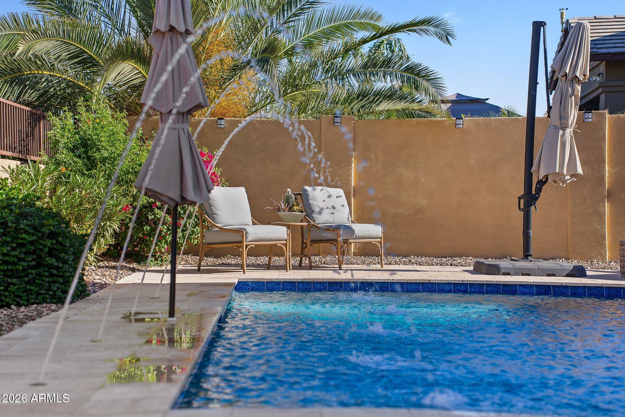 5819 South Wilson Way Gilbert, AZ 85298 - Photo 3 of 76 a bench sitting in the middle of a yard