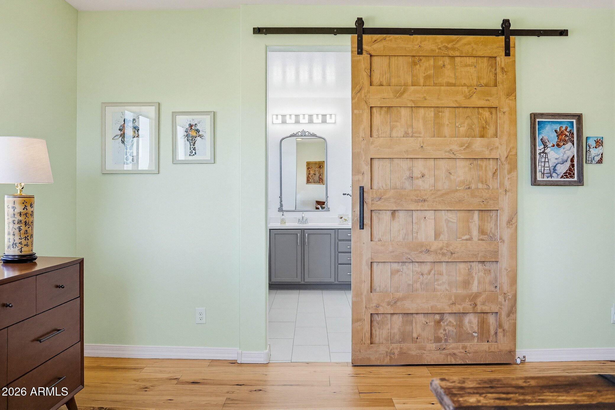 5819 South Wilson Way Gilbert, AZ 85298 - Photo 50 of 76 a bathroom with a sink and a mirror