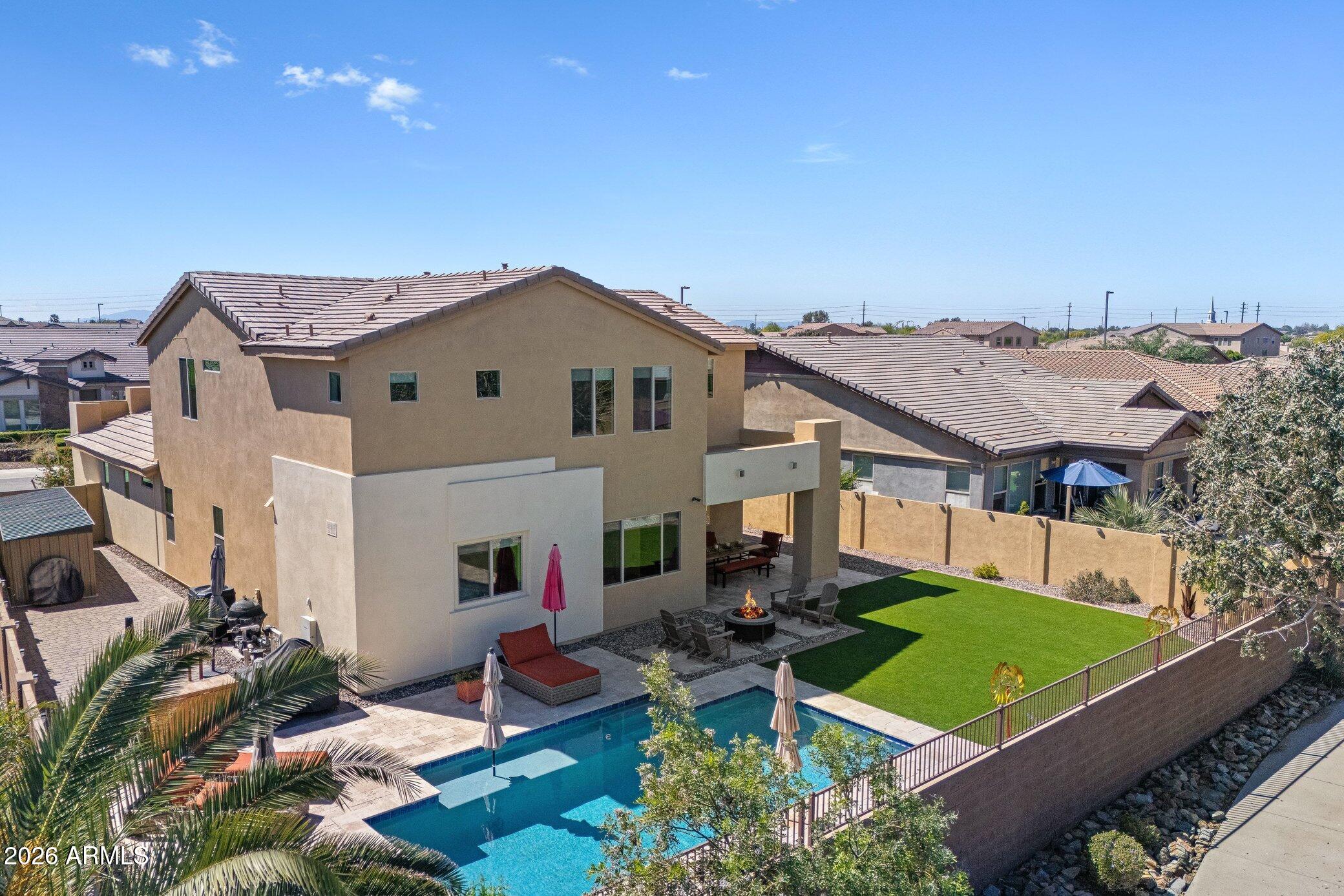 5819 South Wilson Way Gilbert, AZ 85298 - Photo 68 of 76 an aerial view of a house with swimming pool and a yard