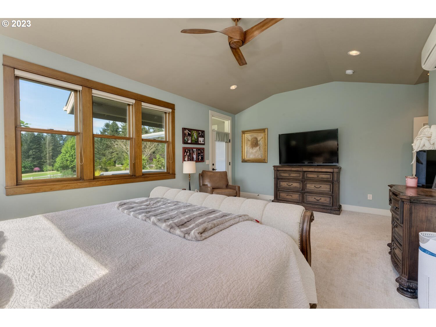 5700 Northwest 304th Street Ridgefield, WA 98642 - Photo 20 of 37 a bedroom with a bed and a flat screen tv