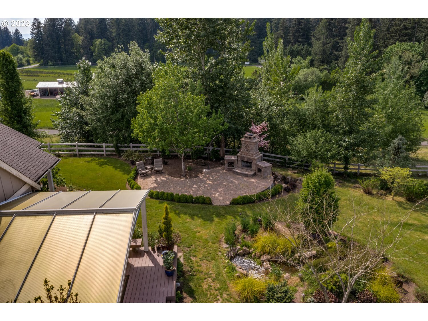 5700 Northwest 304th Street Ridgefield, WA 98642 - Photo 35 of 37 a swimming pool with trees in the background