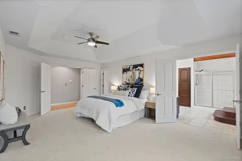 a bed room with a bed and a chandelier