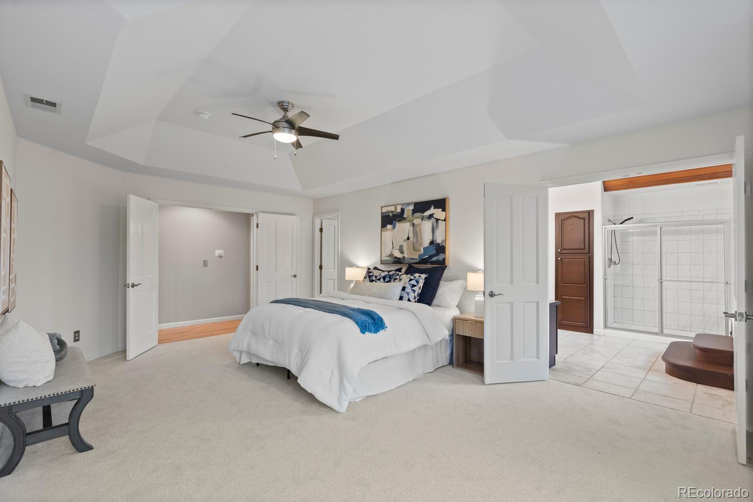 3900 Pierson Street Wheat Ridge, CO 80033 - Photo 22 of 39 a bed room with a bed and a chandelier