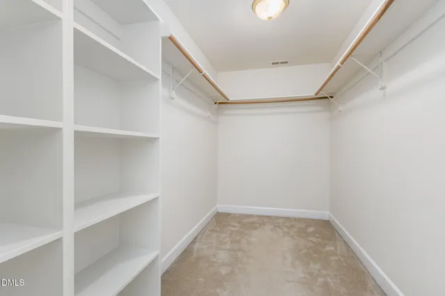 a view of an empty walk in closet