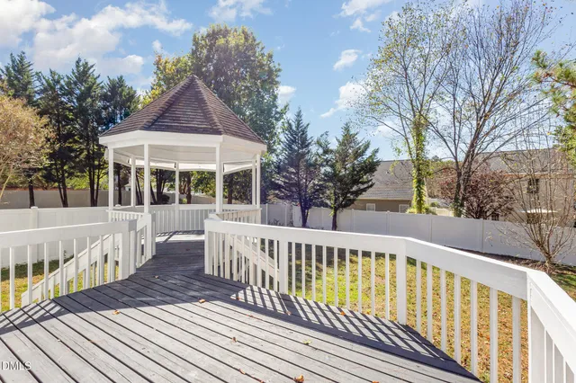 a view of a house with wooden deck
