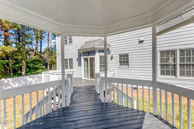 a view of a porch with wooden floor and outdoor space