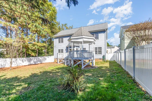 a front view of a house with garden and porch