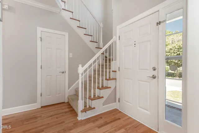 a view of entryway with wooden floor and stair