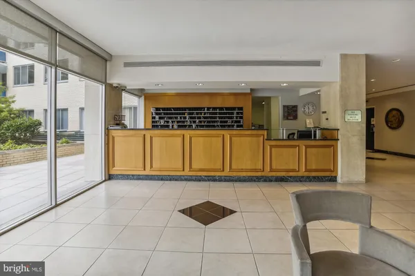 a view of a kitchen with a sink and cabinets