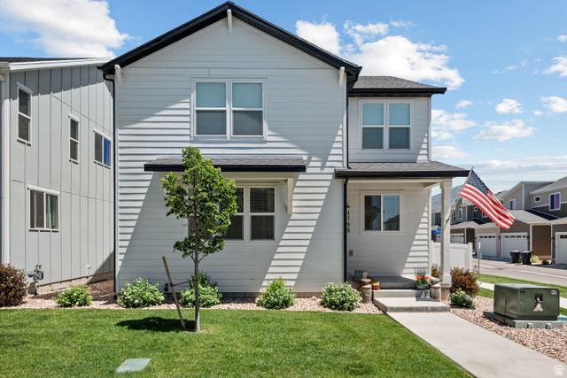 1708 North 1280th Street East Payson, UT 84651 - Photo 1 of 15 Contemporary two-story residence featuring light horizontal siding and a dark roof
