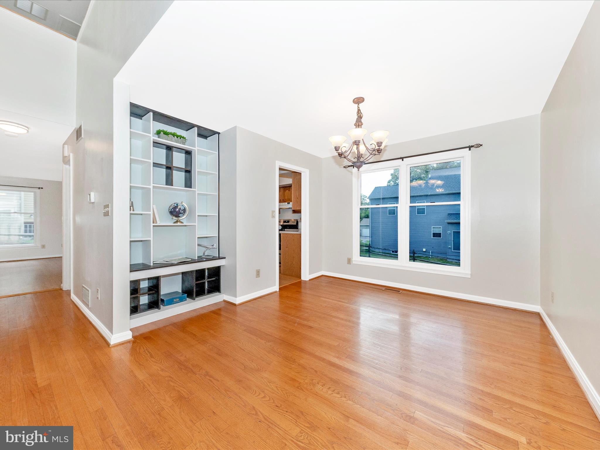 10632 Old Barn Road New Market, MD 21774 - Photo 13 of 76 a view of an empty room with window and wooden floor