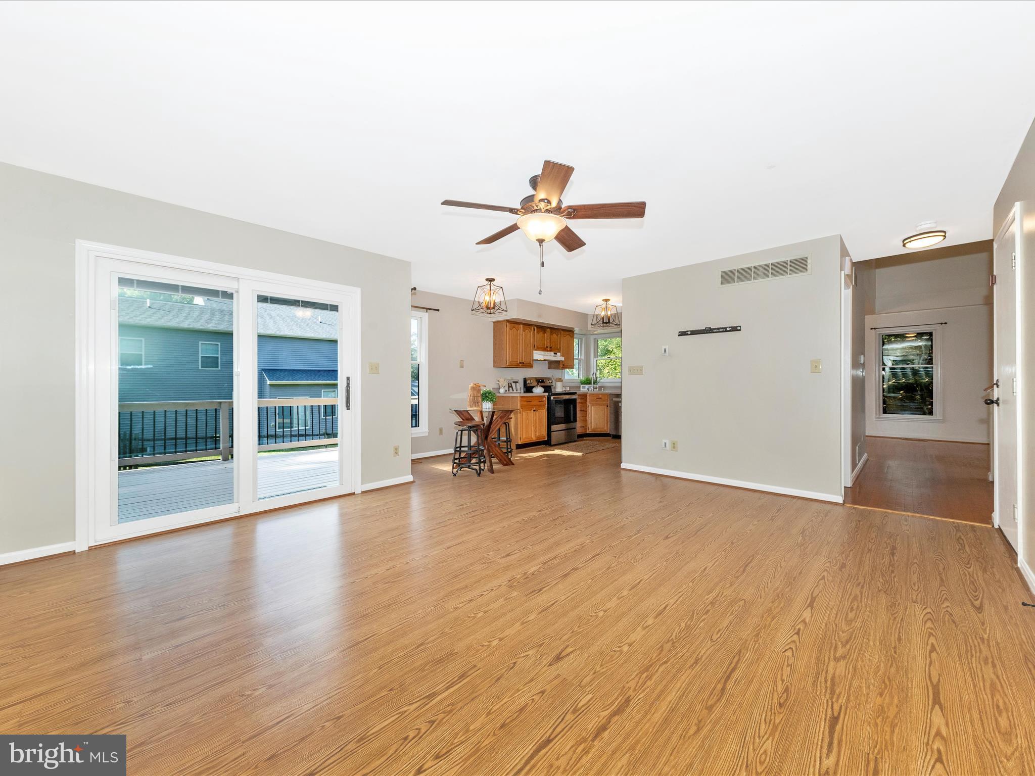10632 Old Barn Road New Market, MD 21774 - Photo 16 of 76 a view of a livingroom with furniture and a ceiling fan