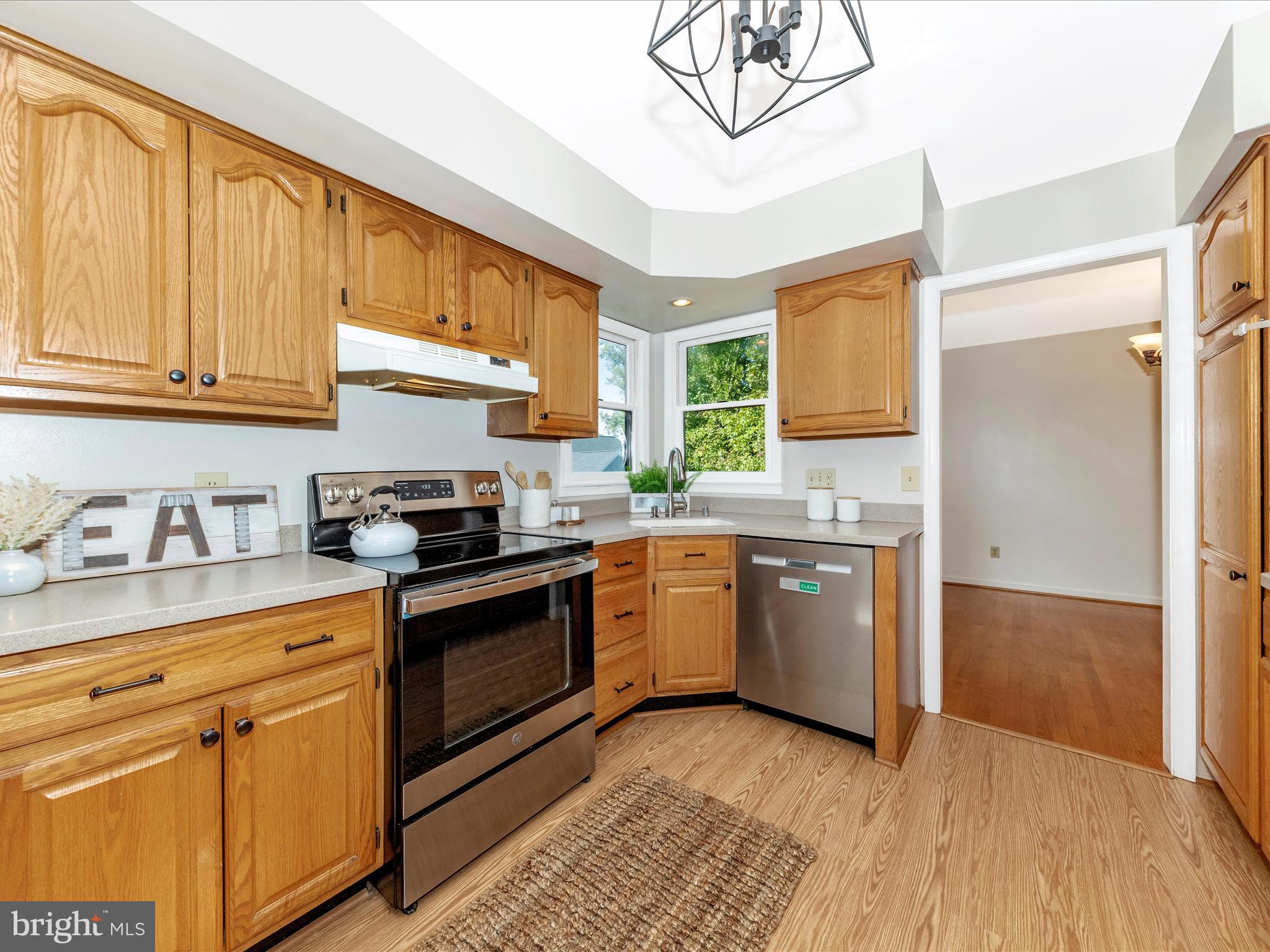 10632 Old Barn Road New Market, MD 21774 - Photo 18 of 76 a kitchen with stainless steel appliances granite countertop a stove a sink and a refrigerator