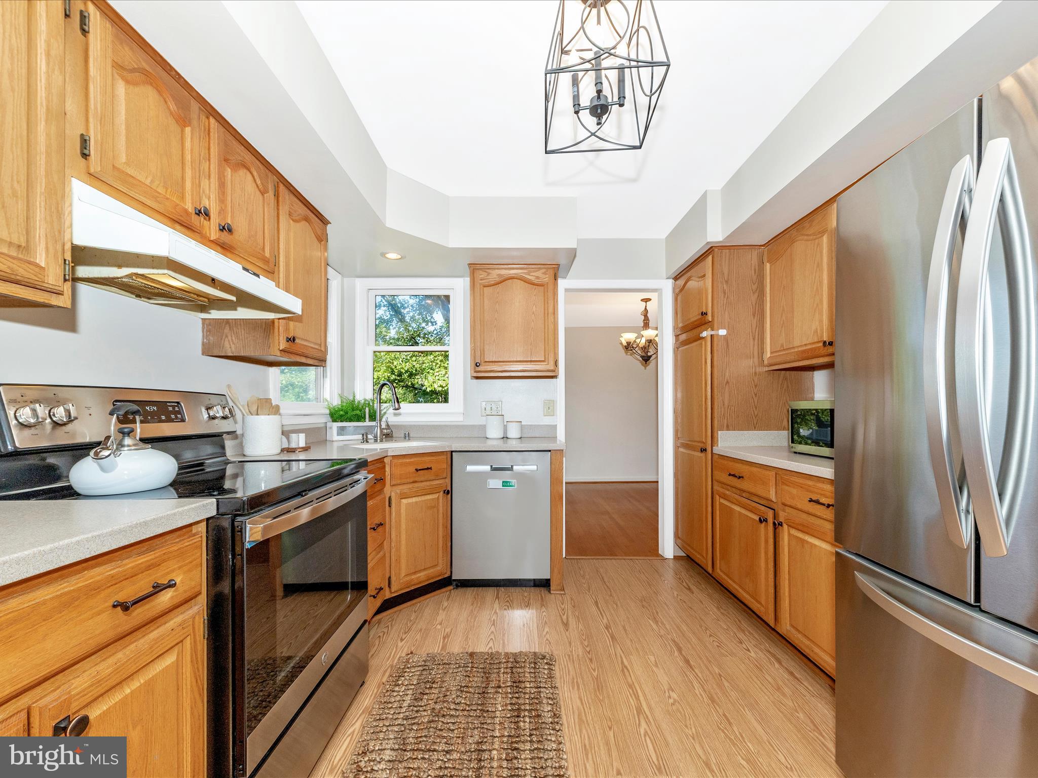 10632 Old Barn Road New Market, MD 21774 - Photo 19 of 76 a kitchen with stainless steel appliances granite countertop a refrigerator a stove and a sink