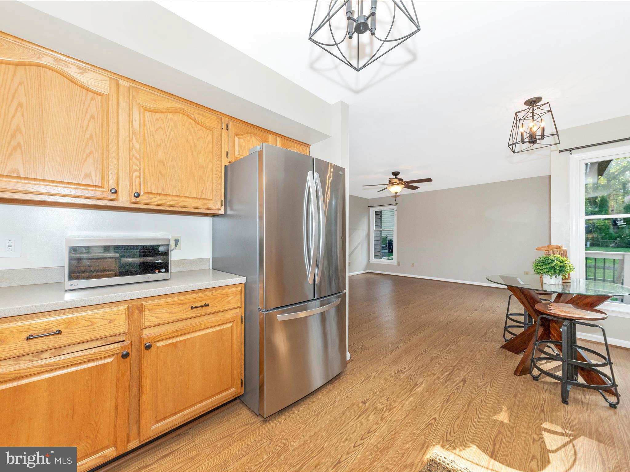 10632 Old Barn Road New Market, MD 21774 - Photo 21 of 76 a kitchen with stainless steel appliances a refrigerator and a stove top oven